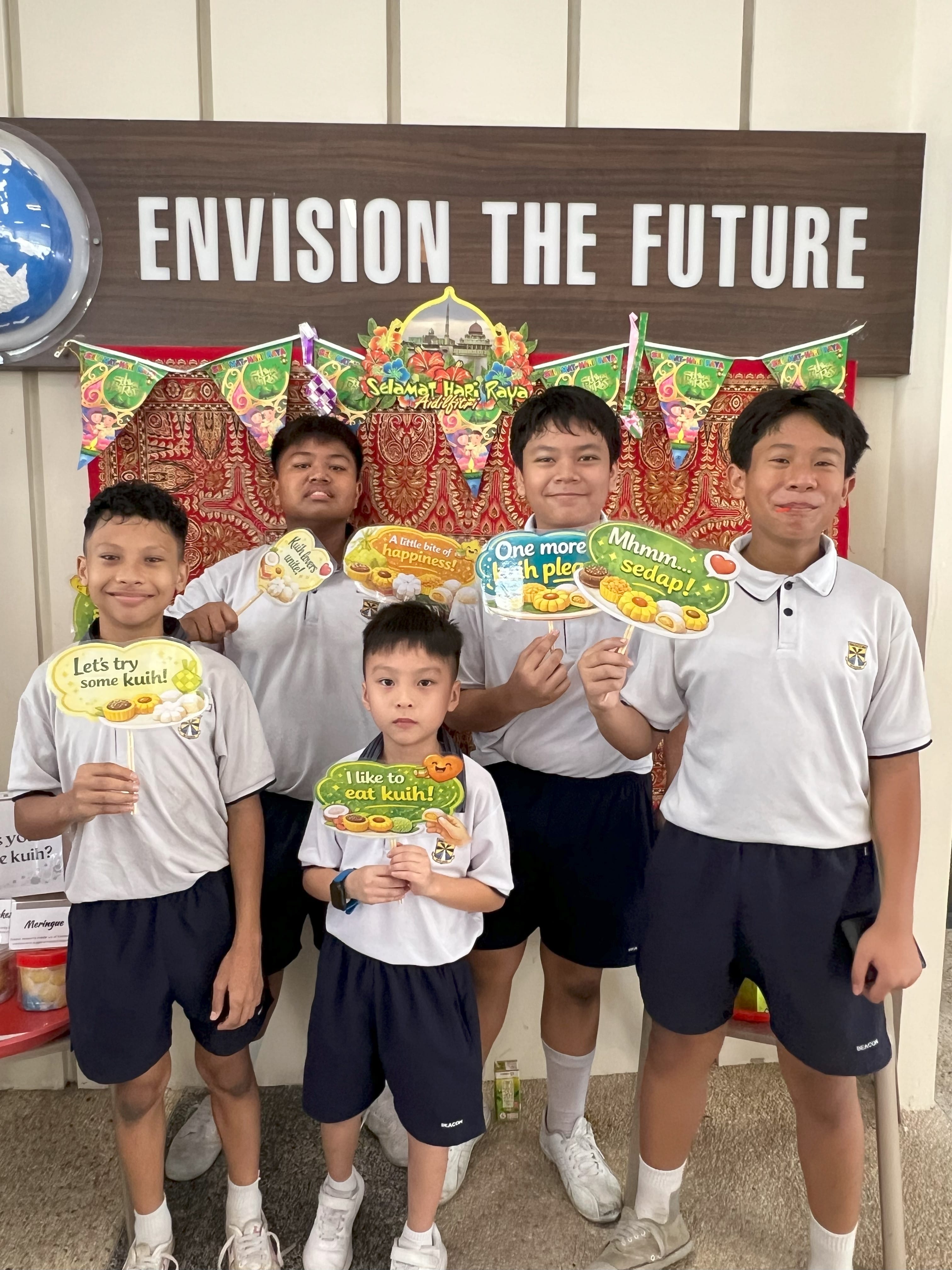 Students trying on various kuih during recess v